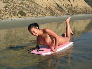 Nude surfer with a great body